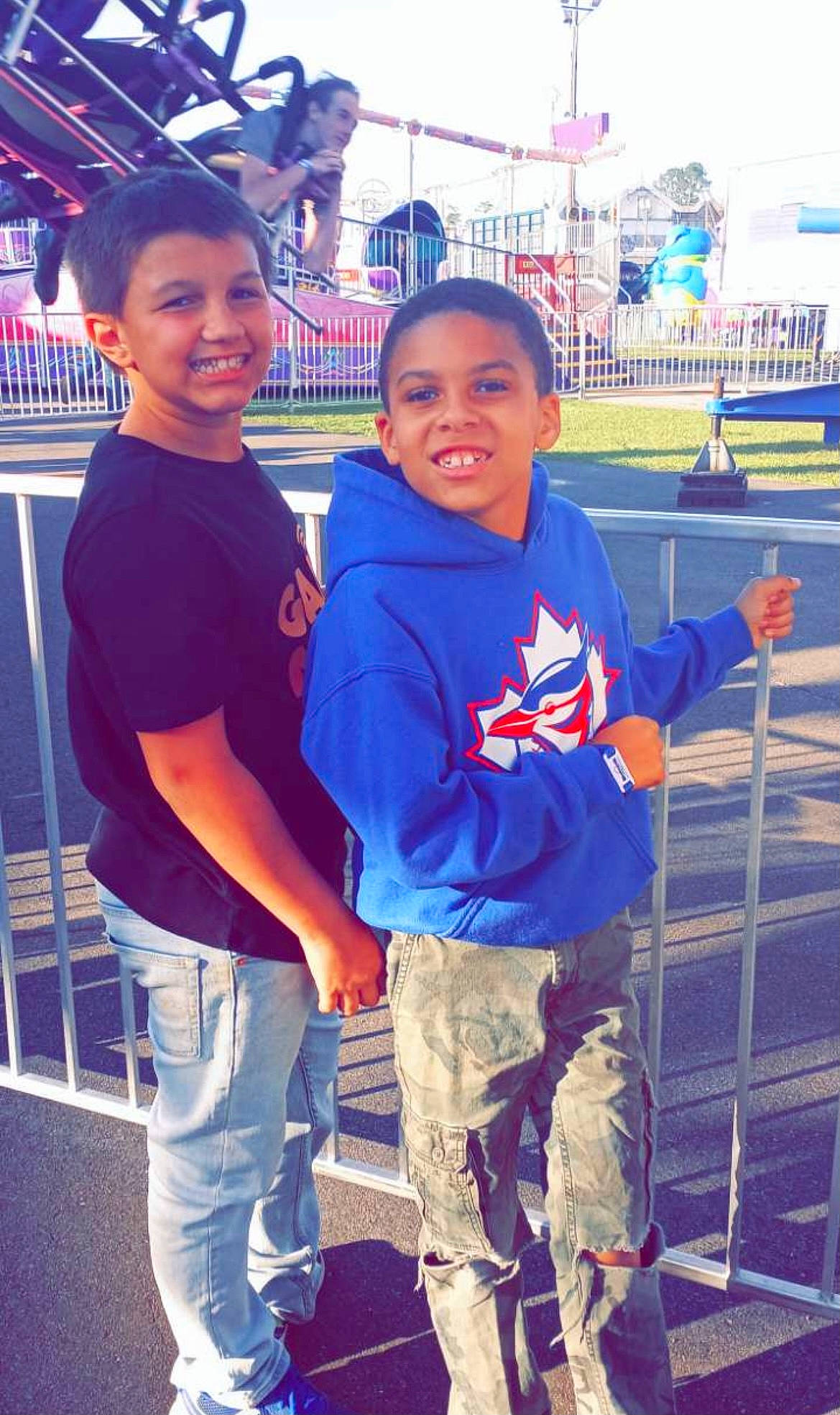 Christian is registered to the contest to win money with this photo: child, community, competition_event, cool, electric_blue, facial_expression, fun, gesture, hairstyle, happy, human, joy, leisure, person, product, recreation, smile, standing, t_shirt, toddler