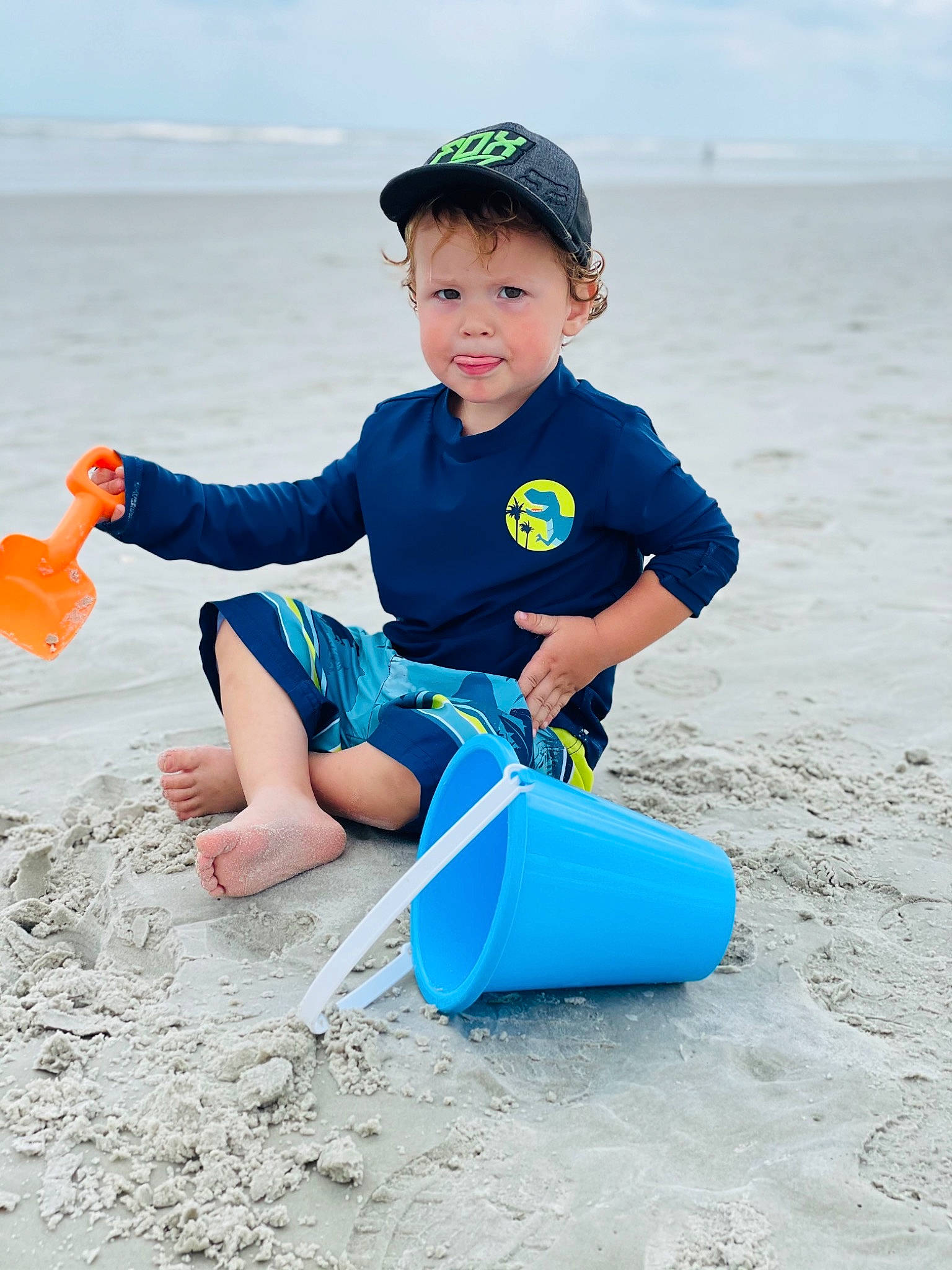 Christian joined the competition — help win amazing prizes! azure, baby_toddler_clothing, baseball_cap, beach, body_of_water, cap, cloud, electric_blue, face, fun, happy, headwear, leisure, people_in_nature, person, recreation, sky, sleeve, standing, t_shirt