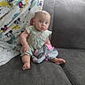 Katlieana joined the competition — help win amazing prizes! baby, child, couch, blanket, mickey_mouse, clothing, indoors, infant, person, sitting, foot, face, expression, curious, soft_fabric, home, casual, colorful, plush, cozy