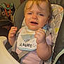 Harlyn joined the competition — help win amazing prizes! baby, high_chair, bib, clothing, child, indoor, person, expression, face, furniture, hand, seatbelt, feeding, young_child, infant, pink_shirt, crying, hair, closeup, home