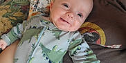 Dalek is registered to the contest to win money with this photo: baby, clothing, coat, couch, cushion, face, furniture, happy, head, homedecor, jacket, knitwear, newborn, person, photography, portrait, quilt, smile, sweater, t_shirt