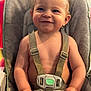 Charles joined the competition — help win amazing prizes! toddler, child, smile, high_chair, straps, diaper, baby, happy, seated, indoor, cute, portrait, baby_face, young_child, safety_harness, skin, hand, expression, hair, person