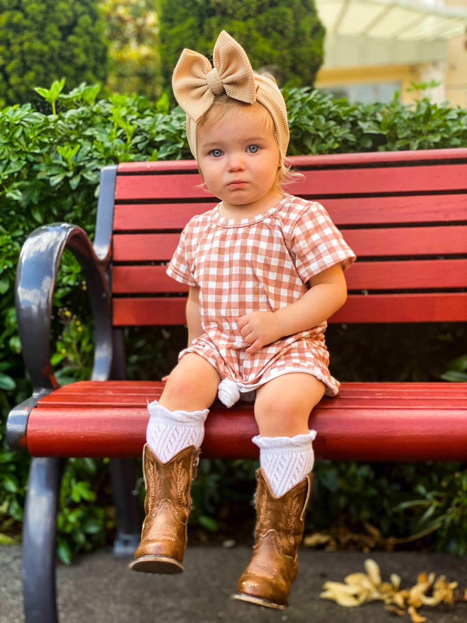 Blake is registered to the contest to win money with this photo: bench, dress, eye, face, fawn, grass, green, hair, hairstyle, happy, head, knee, leg, orange, person, pink, plant, skin, sleeve, summer