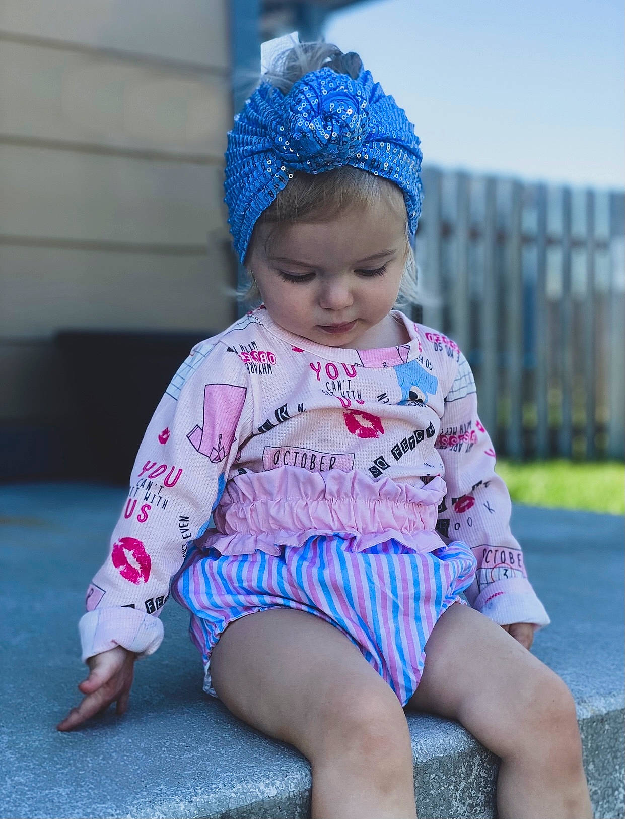 Blake is registered to the contest to win money with this photo: baby_toddler_clothing, blue, cap, clothing, cool, dress, eye, face, happy, head, headgear, headwear, neck, outerwear, person, photograph, pink, purple, skin, sleeve