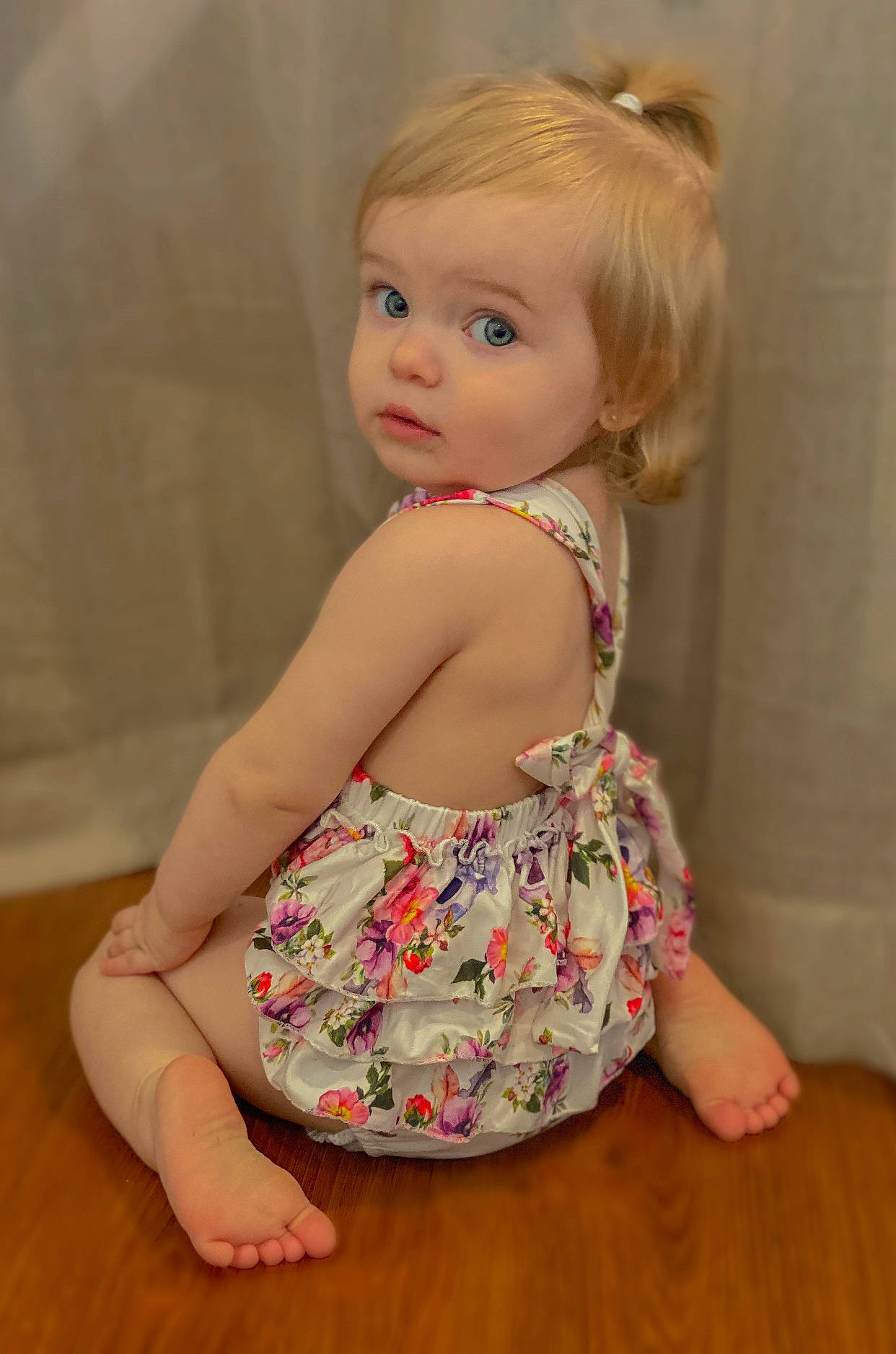 Blake is registered to the contest to win money with this photo: baby_toddler_clothing, day_dress, dress, eye, eyelash, flooring, hair, head, human_body, iris, lip, one_piece_garment, person, pink, skin, sleeve, thigh, toddler, toy, trunk