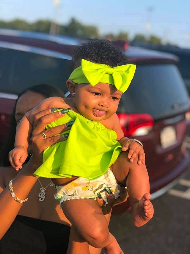 Giselle is registered to the contest to win money with this photo: abdomen, car, child, costume, leg, muscle, person, vehicle, yellow