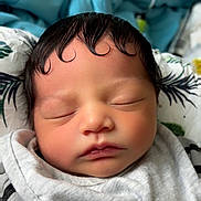 Zamir joined the competition — help win amazing prizes! baby, newborn, sleeping, face, hair, curly_hair, bib, clothing, striped_clothing, blanket, closeup, infant, peaceful, cute, resting, skin, indoors, soft_light, portrait, child