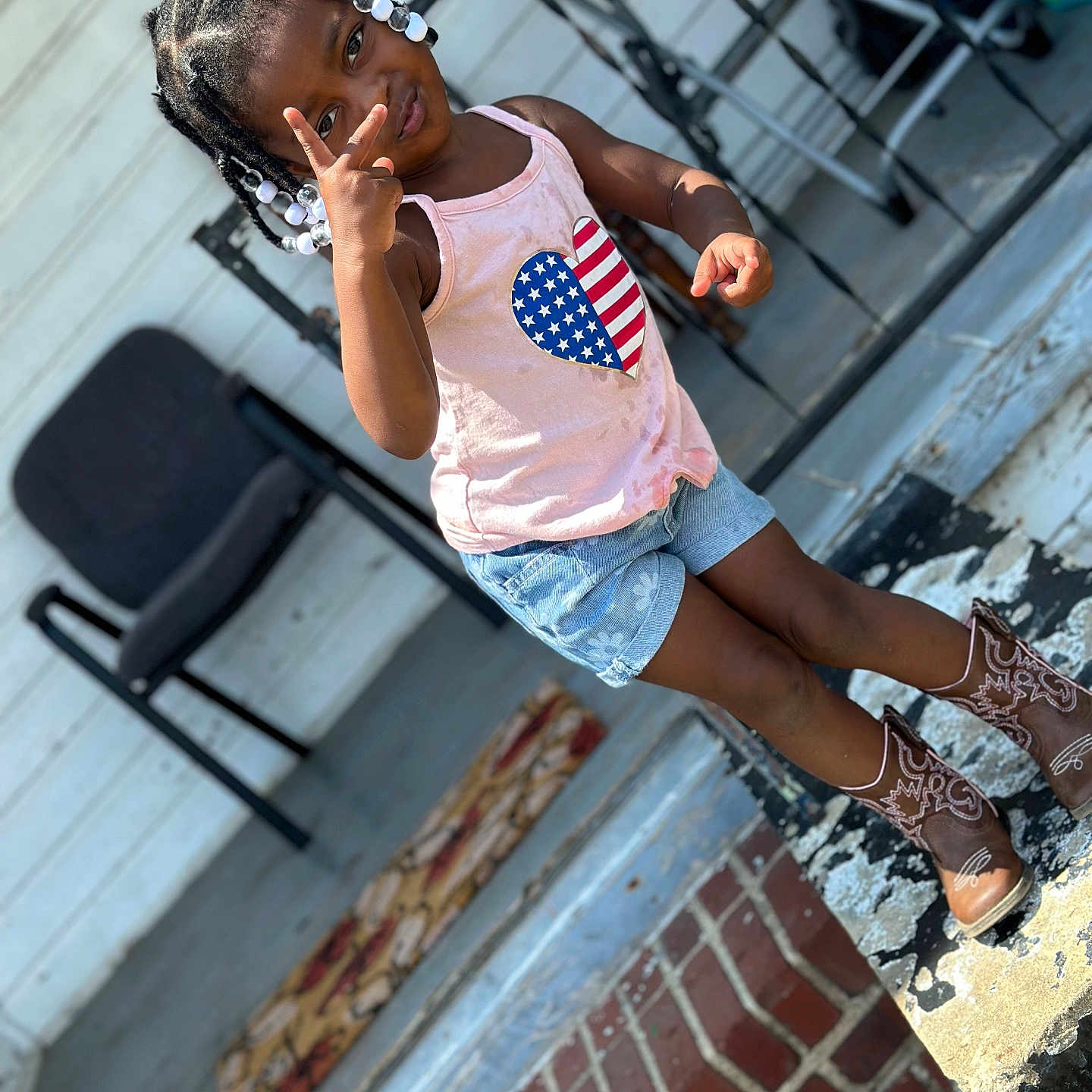 Chelsea is registered to the contest to win money with this photo: child, clothing, cream, dessert, face, female, food, footwear, girl, hair, head, jeans, pants, person, photography, portrait, shoe, shorts, sitting, sleeve