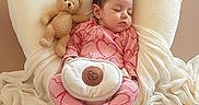Faith is registered to the contest to win money with this photo: baby, sleeping, teddy_bear, heart_pillow, pink_pajamas, footed_pajamas, blanket, soft_toys, infant, cozy, cute, resting, child, adorable, indoor, comfort, peaceful, portrait, head, clothing