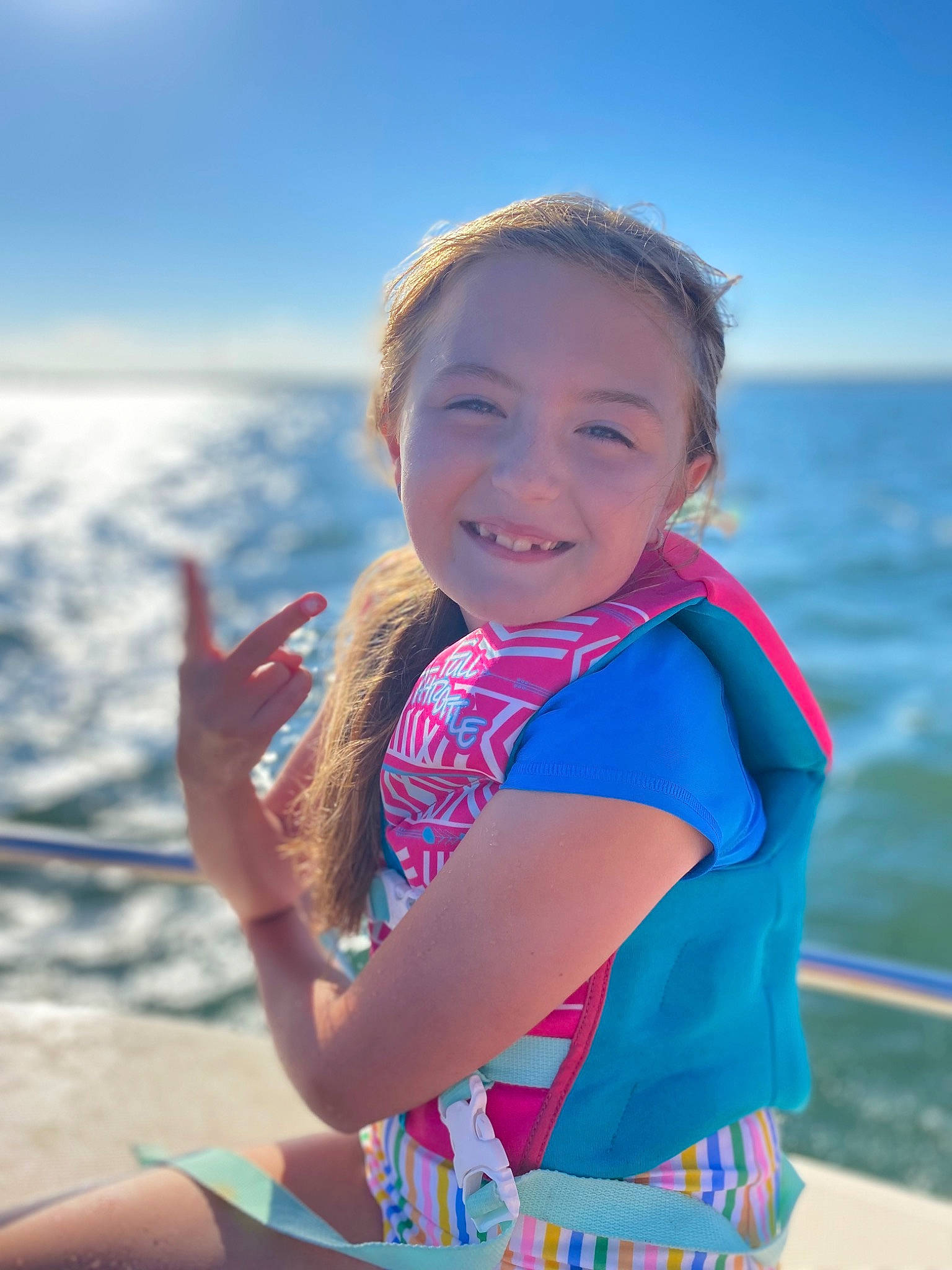 Fiona is registered to the contest to win money with this photo: arm, azure, beach, cloud, flash_photography, fun, gesture, happy, head, joy, leisure, people, people_in_nature, person, skin, sky, smile, standing, summer, sunlight