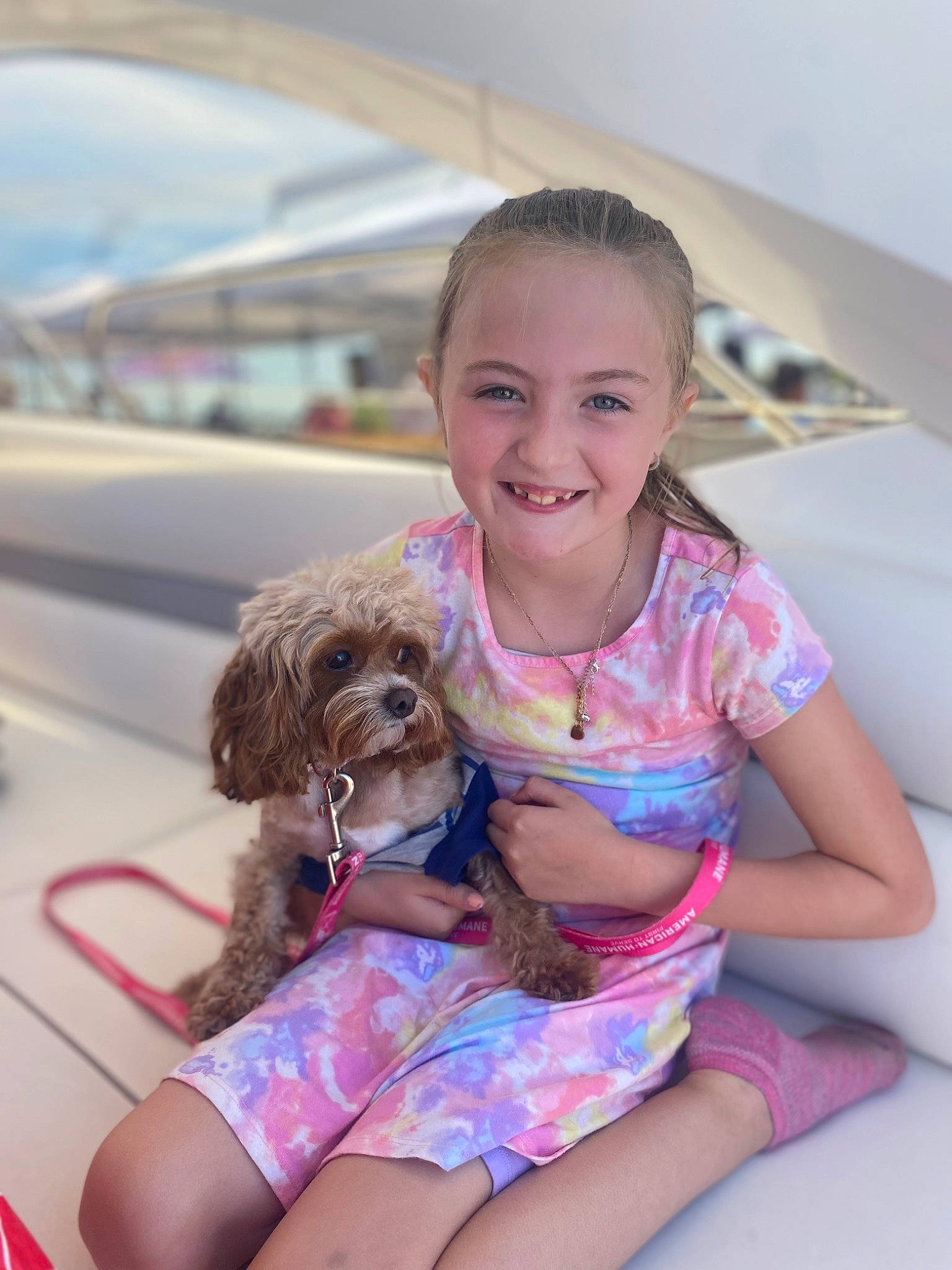 Fiona joined the competition — help win amazing prizes! brown_hair, carnivore, child, companion_dog, dog, dog_breed, fawn, fun, happy, human_leg, joy, leisure, person, pink, sitting, skin, smile, sporting_group, summer, thigh
