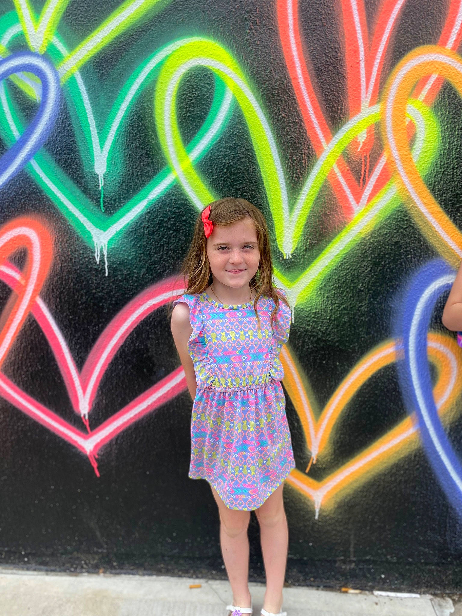 Maeve is registered to the contest to win money with this photo: art, cool, eye, facial_expression, fun, graffiti, green, happy, head, human_body, joy, leisure, light, line, magenta, organ, person, pink, public_space, purple