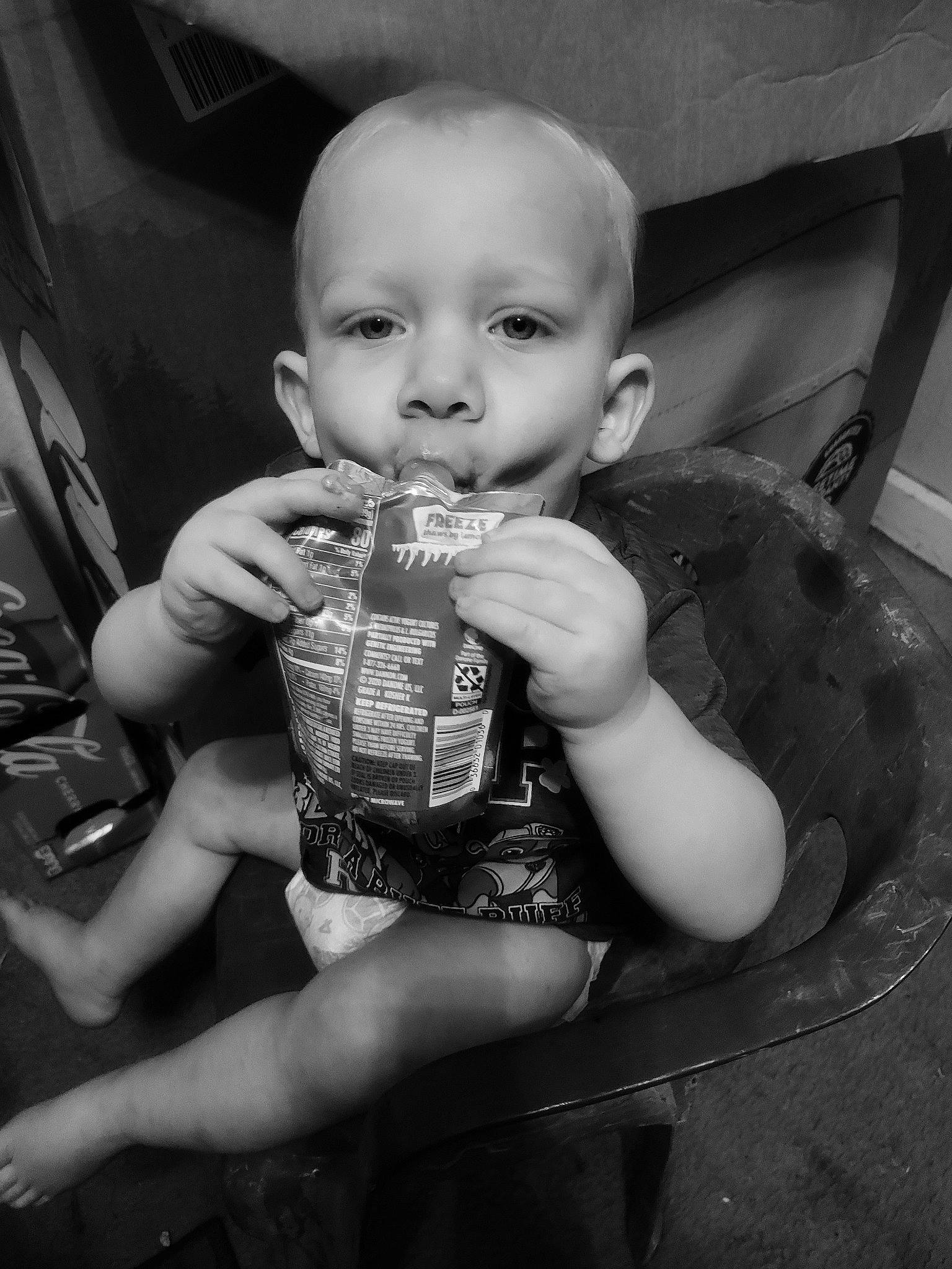 Ryder is registered to the contest to win money with this photo: baby, baby_toddler_clothing, black_and_white, blond, bottle, cheek, drinkware, finger, flash_photography, fun, happy, iris, monochrome, monochrome_photography, nail, person, sitting, skin, standing, style