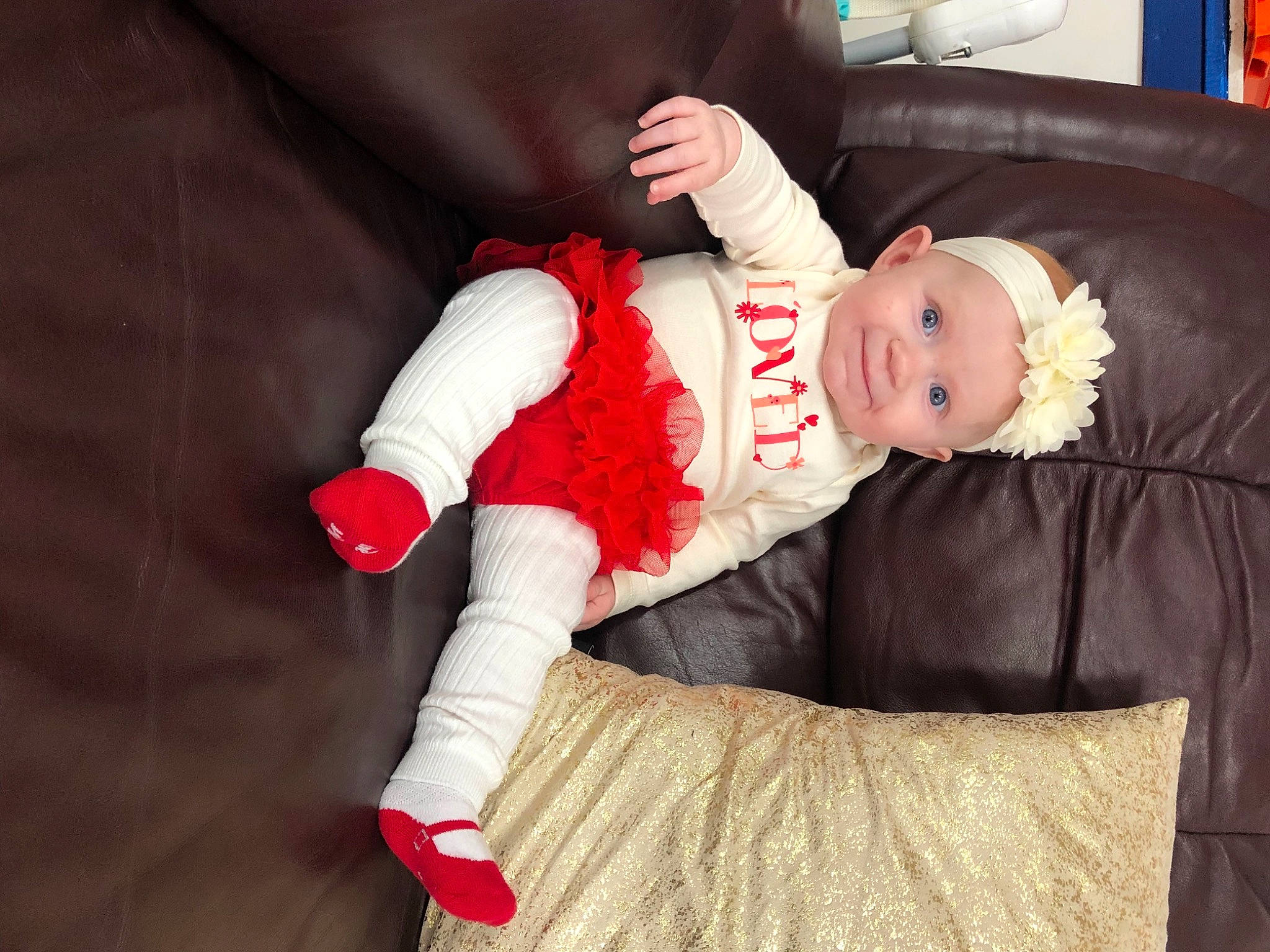 Gemma is registered to the contest to win money with this photo: arm, baby, baby_toddler_clothing, carmine, child, comfort, event, fictional_character, fun, hand, hat, headwear, holiday, joy, knee, lap, person, room, sitting, sleeve