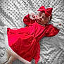 baby, newborn, infant, sleeping, red_dress, hair_bow, headband, white_blanket, textured_blanket, fur_trim, holiday_outfit, cute, peaceful, portrait, cozy, tiny_hands, soft_fabric, indoor, close_up, festive