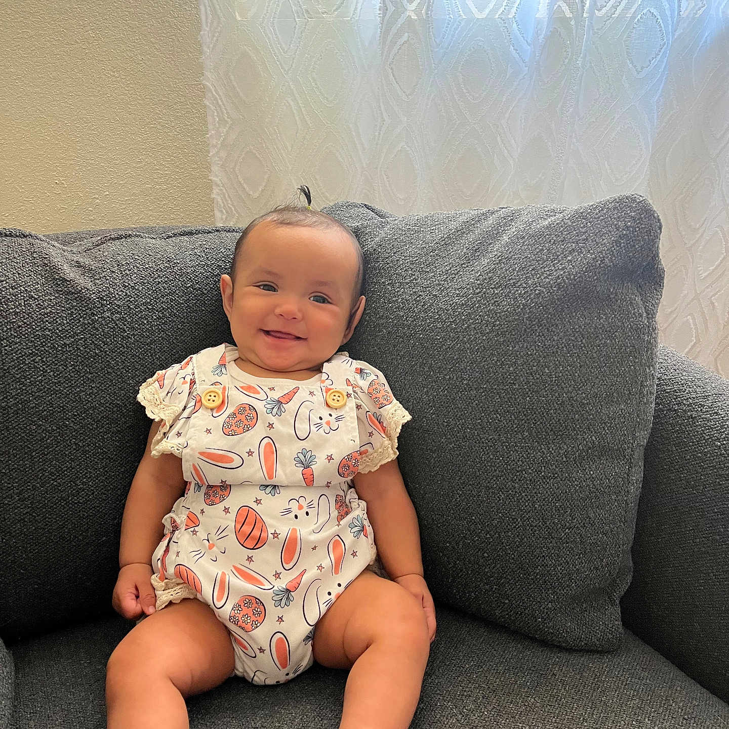 Espi is registered to the contest to win money with this photo: architecture, baby, babylaughing, building, clothing, couch, cushion, diaper, face, furniture, happy, head, homedecor, person, photography, pillow, portrait, sitting, sleeve, smile