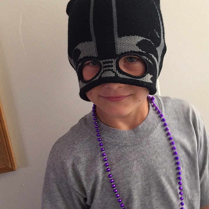 Tavon is registered to the contest to win money with this photo: audio_equipment, costume, electric_blue, event, eyewear, fictional_character, fun, headgear, headphones, jewellery, magenta, mask, outerwear, personal_protective_equipment, picture_frame, purple, sleeve, sports_gear, t_shirt, vision_care