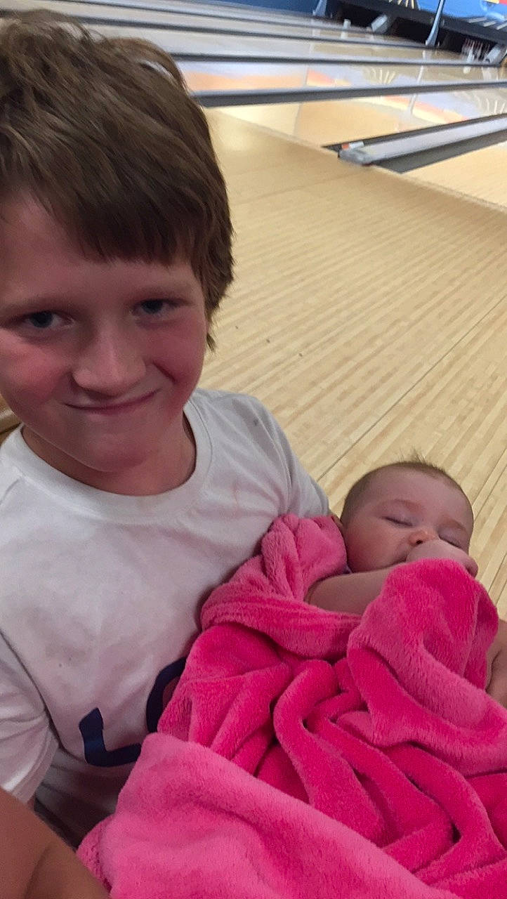 Paxton is registered to the contest to win money with this photo: cheek, chin, comfort, eye, facial_expression, finger, gesture, hairstyle, happy, iris, joy, leg, lip, mammal, mouth, muscle, nose, person, pink, skin