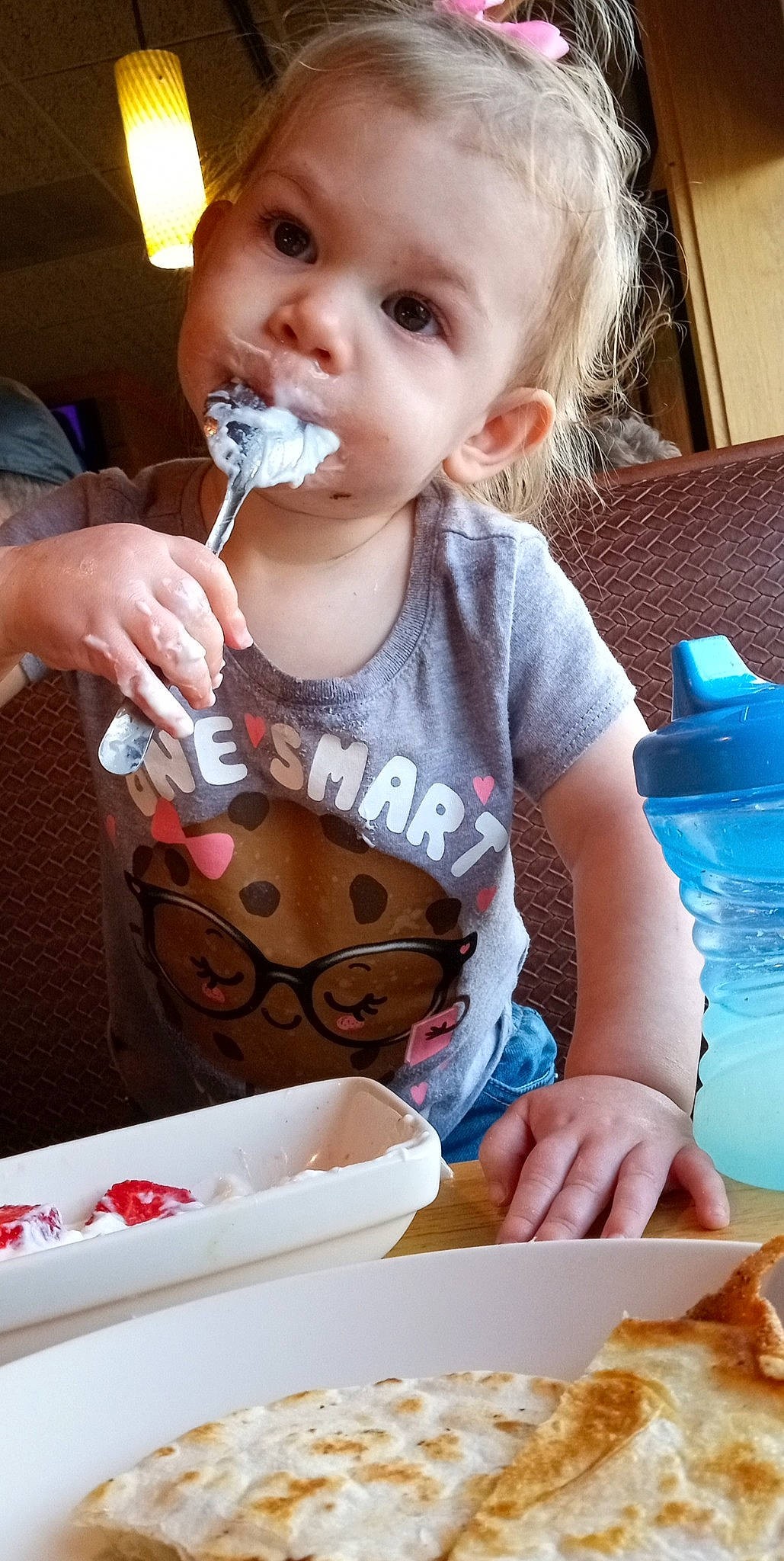 Aubree is registered to the contest to win money with this photo: baby, baby_toddler_clothing, cheek, child, comfort_food, cooking, cuisine, dish, dress, drinking, drinkware, eating, food_craving, junk_food, meal, person, sharing, sweetness, t_shirt, tableware