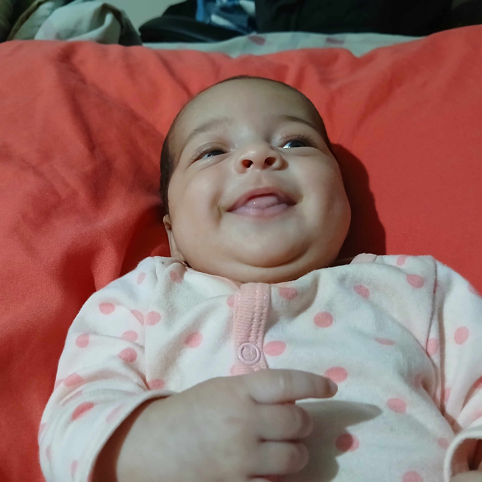 Aurelia joined the competition — help win amazing prizes! baby, infant, smiling, polka_dot, blanket, red, clothing, cute, happy, face, hand, lying_down, child, portrait, indoors, skin, newborn, person, cozy, pink