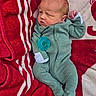 Whitley joined the competition — help win amazing prizes! baby, newborn, infant, onesie, pacifier, blanket, red, white, green, sleepwear, soft, cute, child, lying_down, portrait, cozy, resting, indoors, newborn_baby, warm