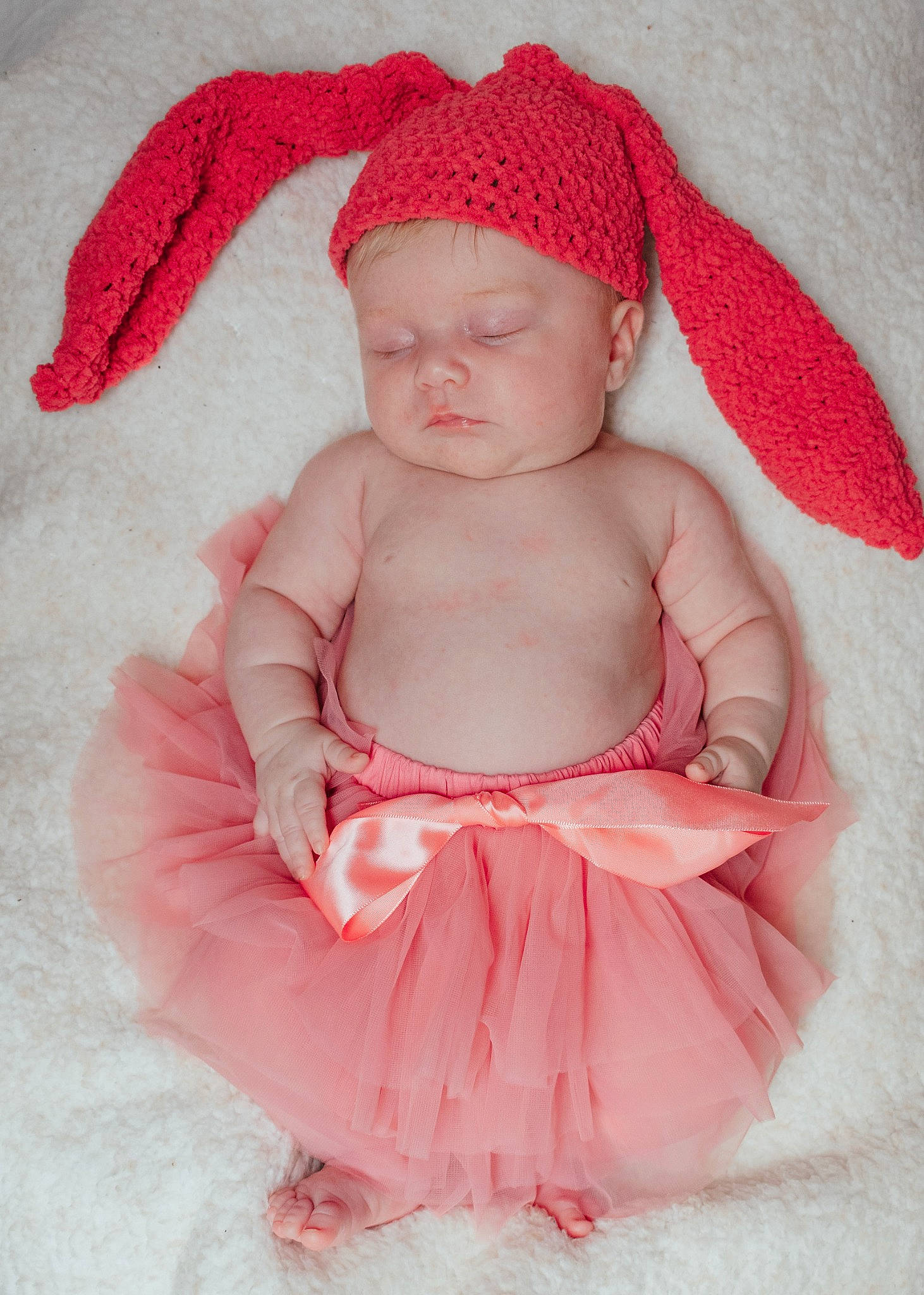 Char'Lee is registered to the contest to win money with this photo: baby, baby_toddler_clothing, beanie, cap, carmine, child, costume_accessory, costume_hat, fashion_accessory, fur, hair_accessory, headwear, linens, magenta, pattern, peach, person, pink, red, sitting