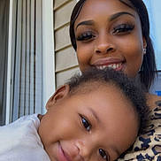 Jayden is registered to the contest to win money with this photo: woman, baby, smile, happy, closeup, portrait, affection, family, indoor, casual, person, clothing, face, hair, skin, window, background, holding, leisure, toddler