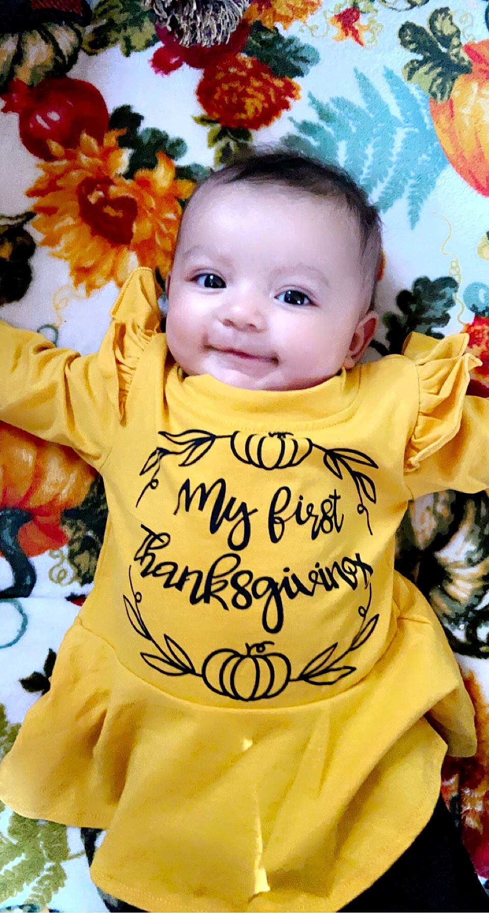 Kyra is registered to the contest to win money with this photo: baby, baby_toddler_clothing, beauty, child, event, face, facial_expression, flower, font, fun, happy, head, orange, organ, people, person, petal, plant, smile, toddler