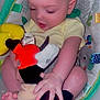 Sylas is registered to the contest to win money with this photo: baby, infant, plush_toy, yellow_onesie, baby_seat, patterned_fabric, green_leaves, cute, child, small_hands, barefoot, soft_toy, indoor, seated, looking_down, adorable, skin, head, face, peaceful
