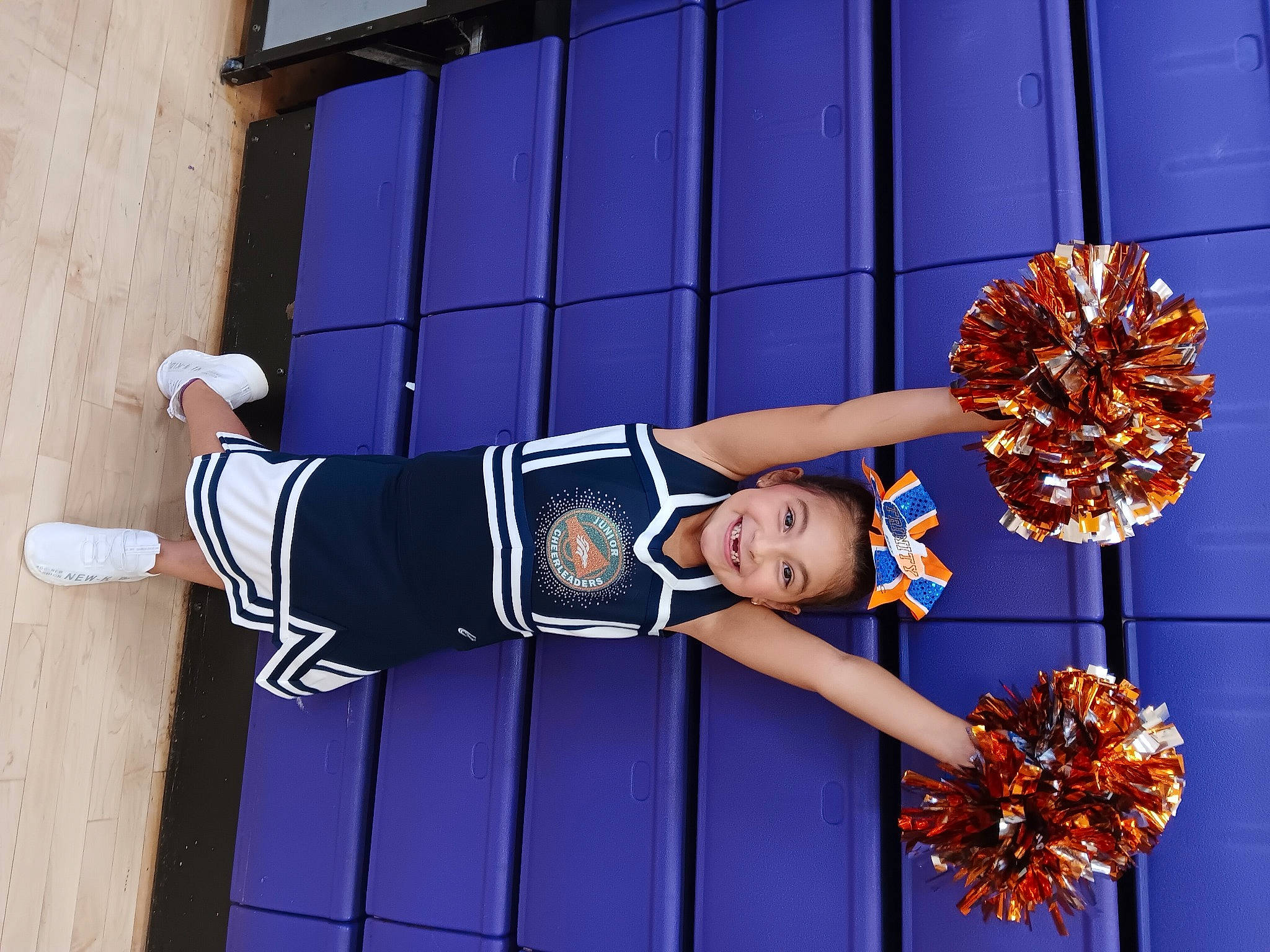 Trinity joined the competition — help win amazing prizes! cheerleading_uniform, dress, electric_blue, event, fashion_accessory, fashion_design, hat, human_leg, joy, knee, person, shoe, sports_uniform, sportswear, thigh, uniform, window, wrist