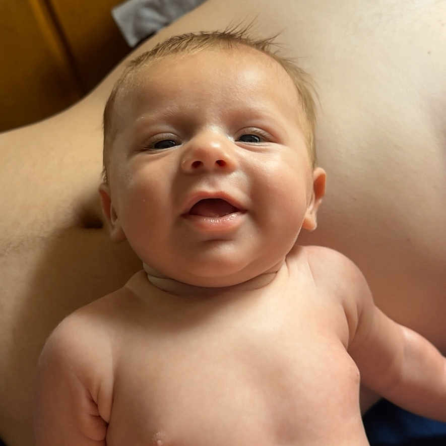 Huntley is registered to the contest to win money with this photo: baby, back, bodypart, face, finger, hand, happy, head, mouth, neck, newborn, person, photography, portrait, smile, towel
