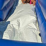 activity, blue, braided_hair, child, fun, happy, inflatable, leisure, outdoor, person, pink_swimsuit, play, recreation, slide, smiling, sport, summer, sunlight, water, water_slide