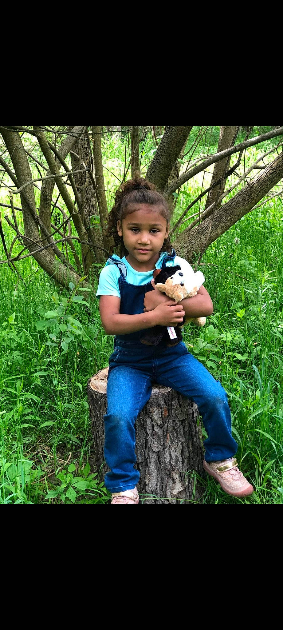 Isabella Rose joined the competition — help win amazing prizes! botany, child, flash_photography, forest, grass, green, happy, jeans, leaf, leisure, natural_environment, natural_landscape, people_in_nature, person, plant, recreation, sitting, sneakers, terrestrial_plant, toddler