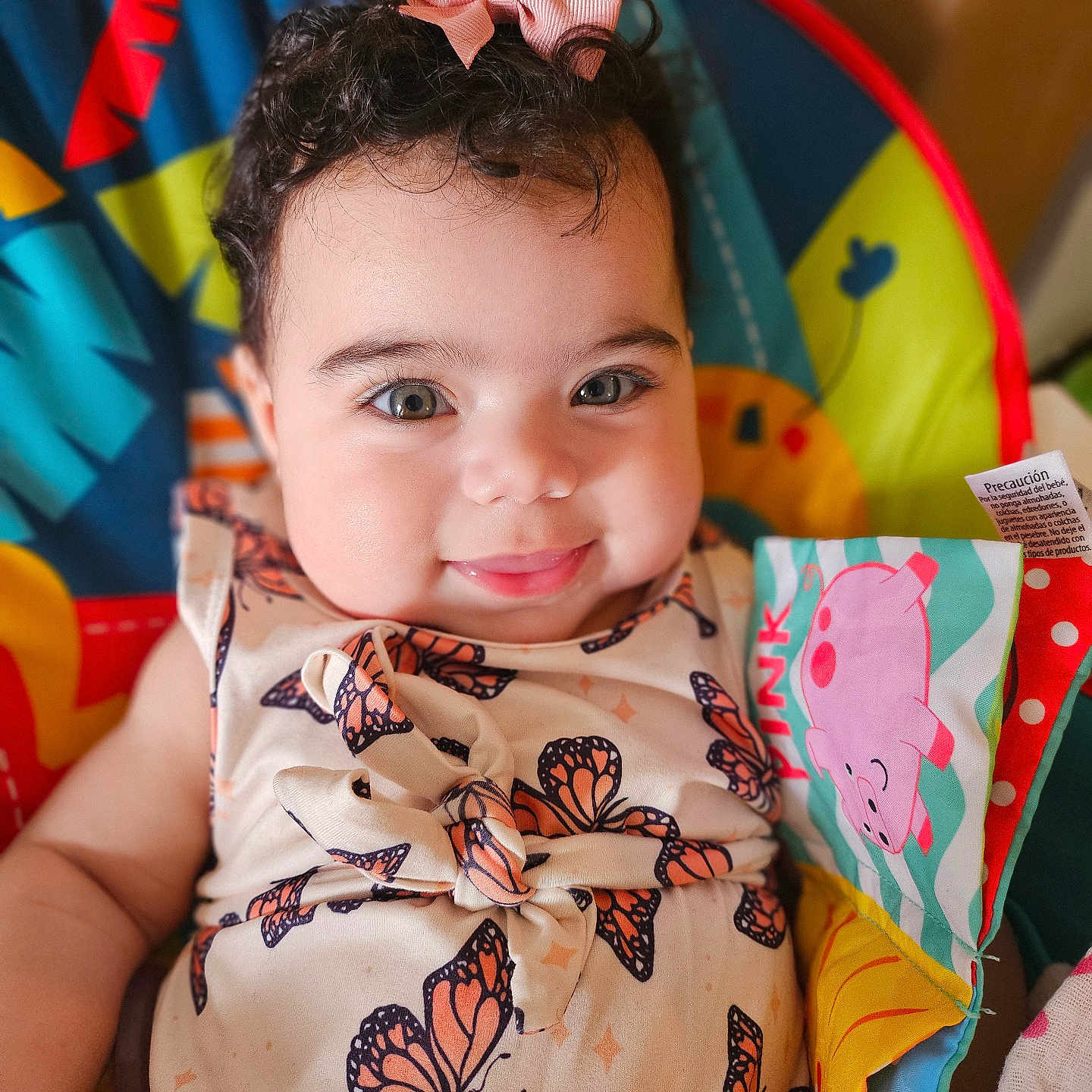 Evani is registered to the contest to win money with this photo: animal, baby, blanket, bodypart, clothing, cushion, dress, face, finger, furniture, hand, happy, head, homedecor, person, photography, portrait, skin, smile, tattoo