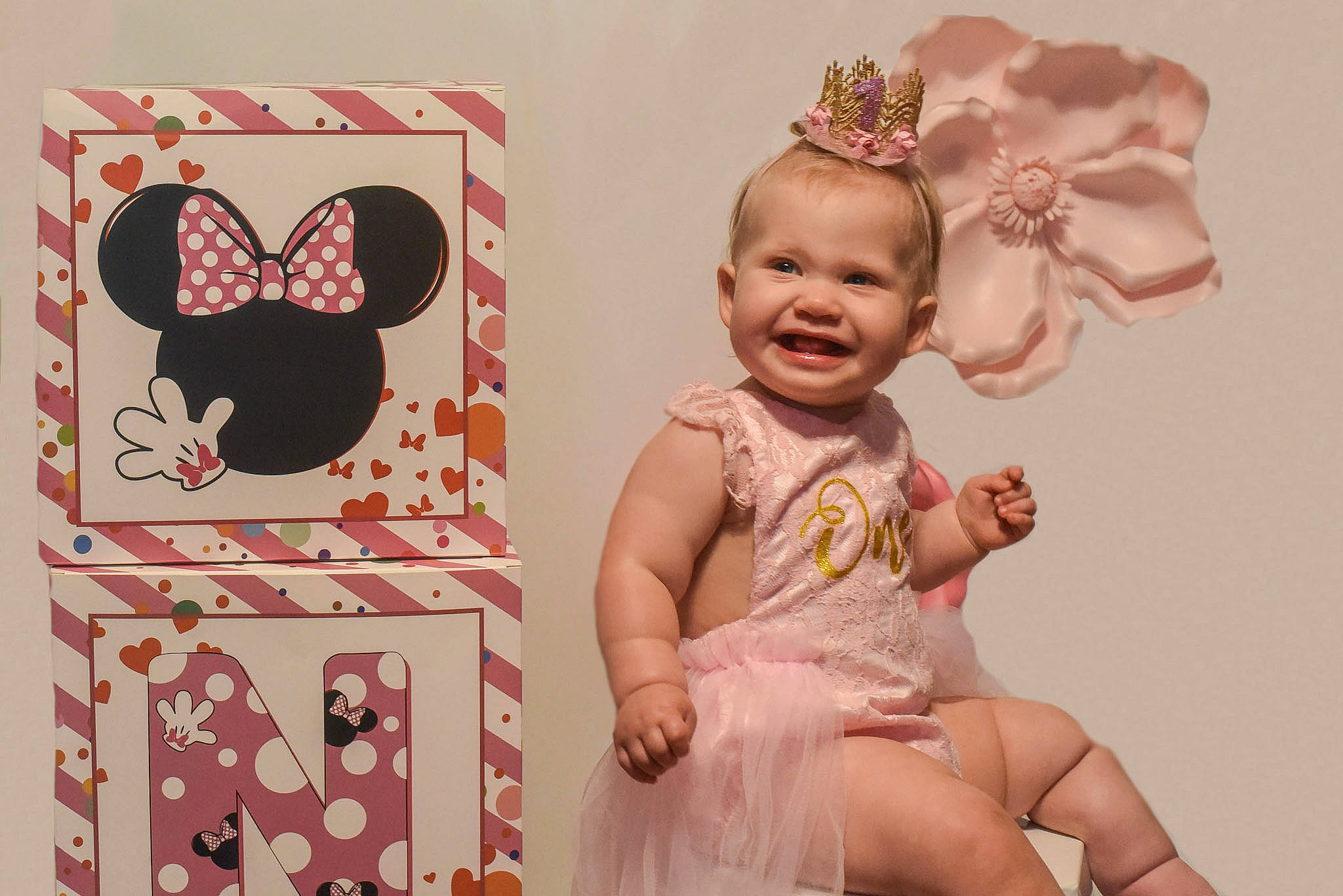 Jade is registered to the contest to win money with this photo: baby, baby_toddler_clothing, child, costume_hat, event, fashion_accessory, happy, headband, headpiece, joy, magenta, party_supply, pattern, peach, person, picture_frame, pink, room, smile, toddler