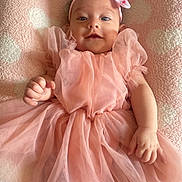 Nevaeh joined the competition — help win amazing prizes! accessories, baby, blanket, bodypart, clothing, dress, face, finger, formalwear, hand, happy, hat, head, newborn, person, photography, portrait, sitting, sleeve, smile