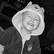 Jayden participe au concours pour gagner de l'argent avec cette photo : child, toddler, smiling, hood, jacket, indoor, black_and_white, portrait, happy, cute, baby, clothing, face, person, expression, young_child, cozy, funny, cute_outfit, joy