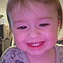 Atalli is registered to the contest to win money with this photo: toddler, child, smiling, face, teeth, close_up, indoors, happy, person, baby, cute, apparel, patterned_clothing, young_child, portrait, head, hair, skin, expression, home
