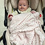 baby, blanket, child, clothing, comfort, cozy, cushion, cute, expression, happy, head, indoors, infant, pale_pink, person, seat, smile, soft_texture, stroller, warm