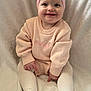 baby, infant, smiling_baby, pink_headband, bow, sweater, knitwear, embroidery, tights, white_tights, blanket, cozy, sitting, portrait, closeup, big_eyes, chubby_cheeks, soft_texture, innocence, cute