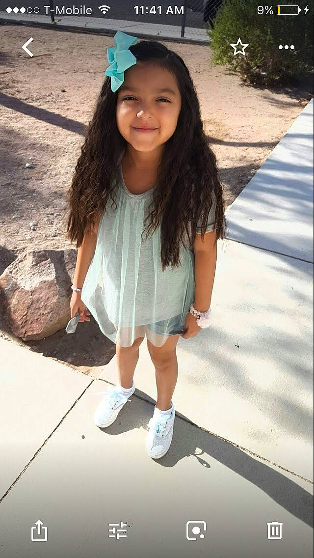 Elizah is registered to the contest to win money with this photo: black_hair, child, child_model, cool, fun, hair_accessory, hairstyle, happy, headgear, long_hair, person, shoe, smile, snapshot, street_fashion, style, t_shirt, white