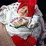 Tilly-Mae is registered to the contest to win money with this photo: baby, sleeping, red_bow, headband, holiday_sweater, blanket, cozy, cute, infant, clothing, toddler, relaxed, portrait, warm, child, soft_lighting, cute_outfit, holiday_theme, white_sweater, red_pants