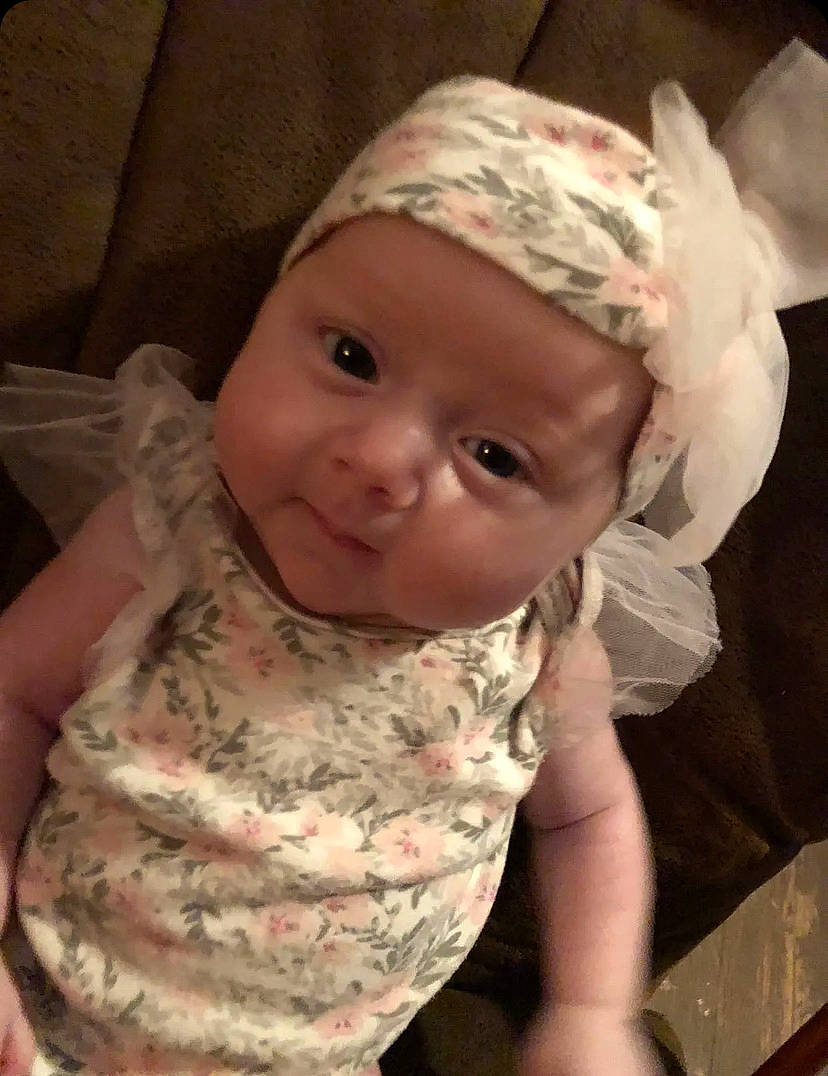 Lucy joined the competition — help win amazing prizes! baby, baby_toddler_clothing, cap, cheek, chin, dress, eyebrow, forehead, headgear, headwear, helmet, human_body, iris, lip, mouth, nose, person, pink, skin, sleeve