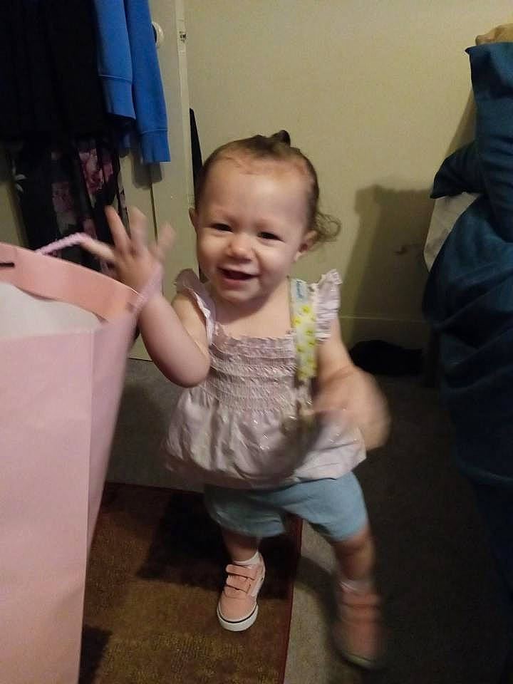 Layla is registered to the contest to win money with this photo: baby, baby_toddler_clothing, cheek, child, eye, finger, flooring, foot, fun, gesture, hand, happy, joy, leg, person, room, sitting, skin, smile, t_shirt