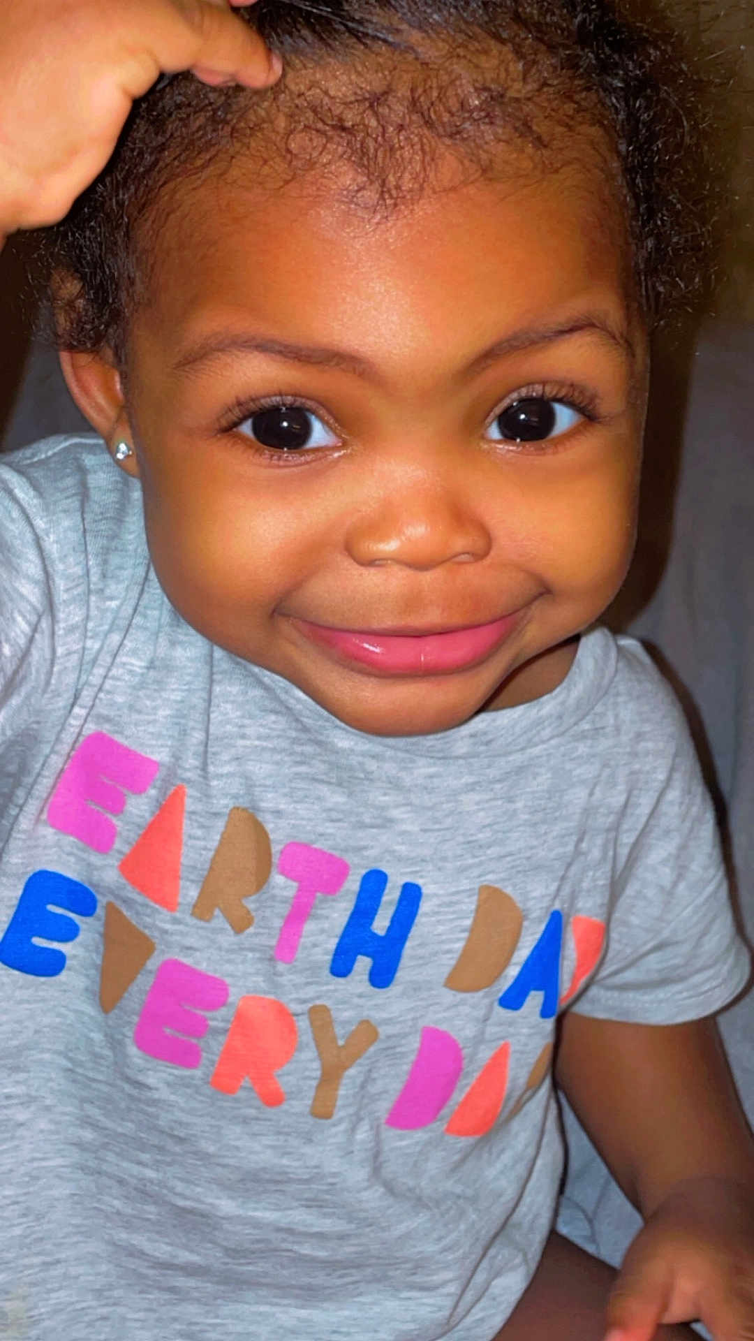 Laila is registered to the contest to win money with this photo: accessories, baby, bodypart, clothing, cosmetics, earring, face, happy, head, jewelry, lipstick, mouth, person, photography, portrait, shirt, skin, smile, t_shirt, teeth