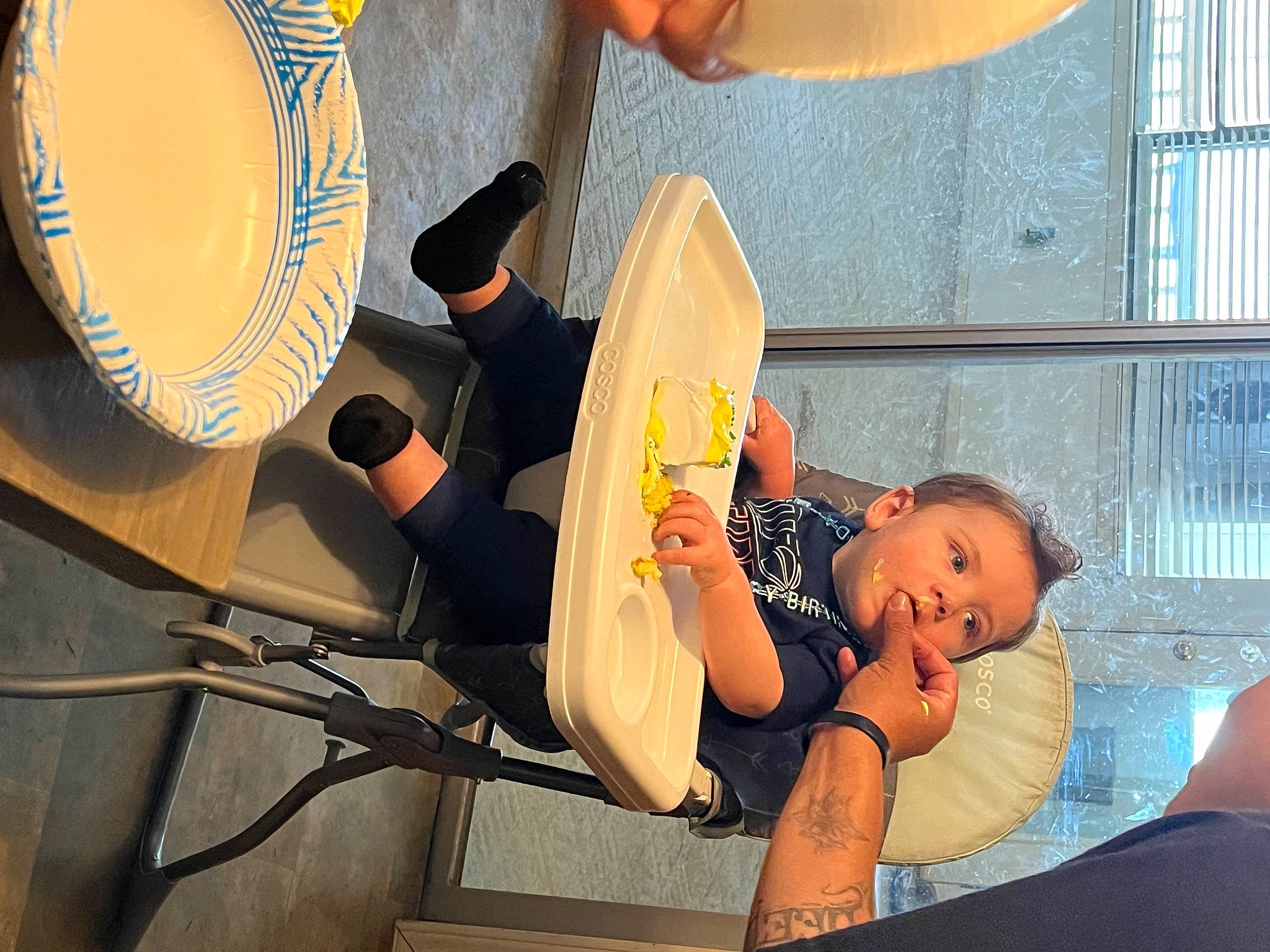 Lakota is registered to the contest to win money with this photo: audio_equipment, baby, baby_products, chair, comfort, drum, elbow, hand, hat, human_leg, knee, leisure, membranophone, musical_instrument, person, personal_protective_equipment, service, sitting, thigh, toddler