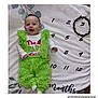 Giovani joined the competition — help win amazing prizes! baby, infant, green_outfit, grinch_costume, smiling, lying_down, blanket, months_marker, numbers, wreath, cute, happy, child, celebration, holiday_theme, white_blanket, soft_texture, portrait, cozy, festive