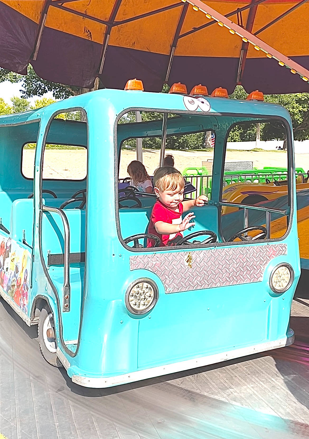 Xander is registered to the contest to win money with this photo: advertising, auto_part, automotive_design, automotive_exterior, automotive_wheel_system, car, classic, commercial_vehicle, fun, green, leisure, mode_of_transport, motor_vehicle, person, public_transport, recreation, tire, travel, vehicle, vehicle_door