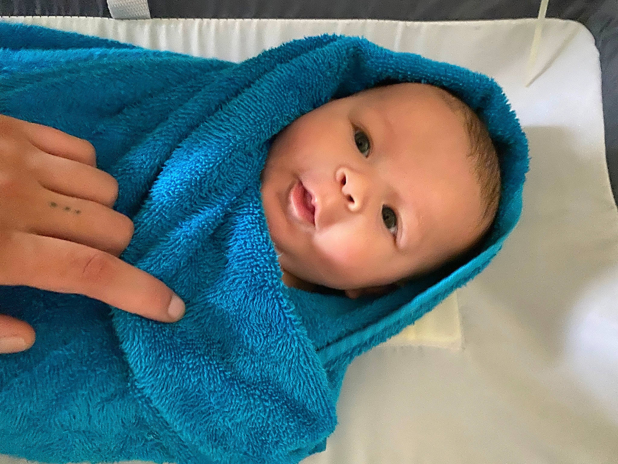 Tobias joined the competition — help win amazing prizes! aqua, baby, baby_toddler_clothing, blue, cheek, comfort, electric_blue, eye, eyebrow, face, gesture, head, iris, linens, nose, outerwear, person, skin, sleeve, textile