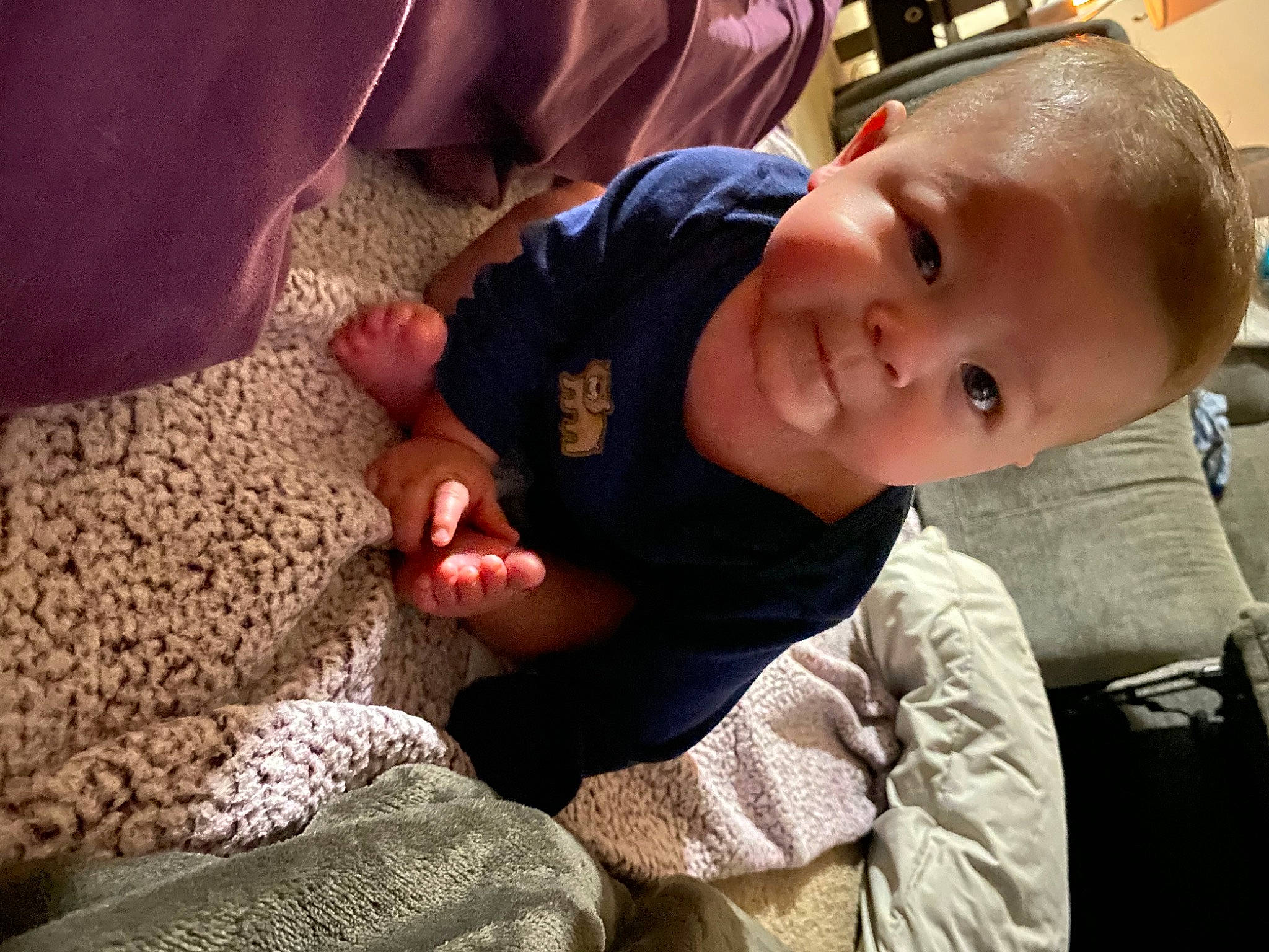 Tobias is registered to the contest to win money with this photo: baby, baby_toddler_clothing, cheek, child, comfort, eye, finger, foot, gesture, grass, happy, hat, head, human_body, mammal, nose, person, sitting, skin, smile